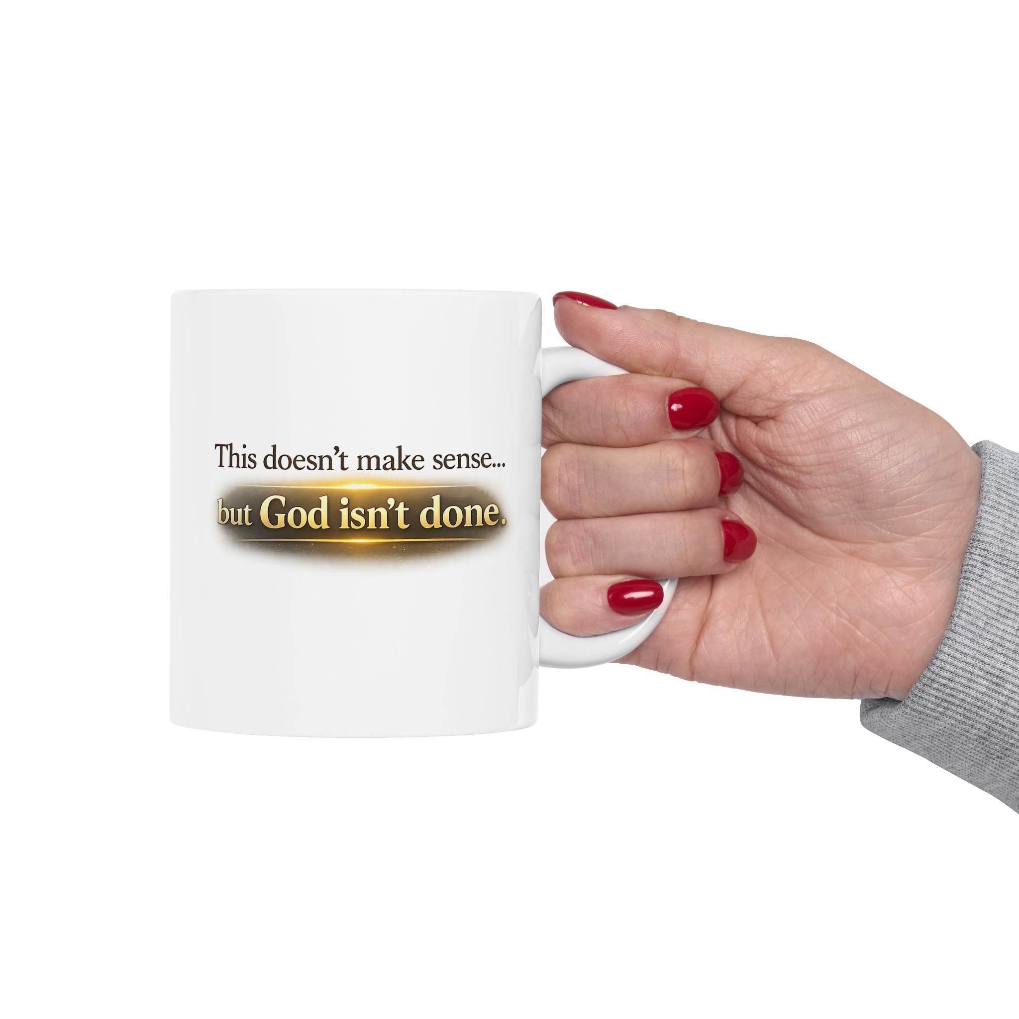 Christian faith encouragement mug with "God Isn't Done" quote