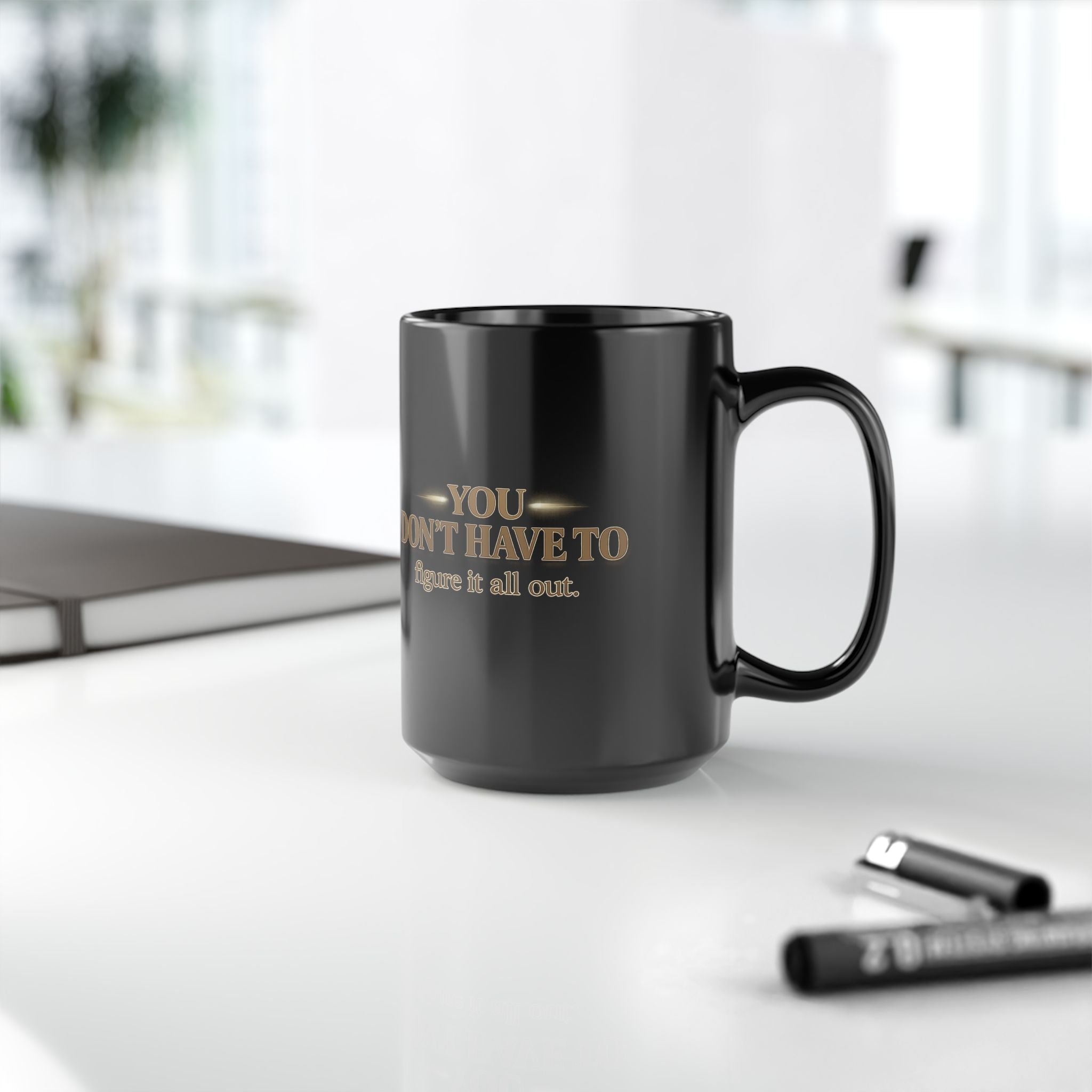 Christian faith coffee mug with text 'You Don't Have to Figure It All Out' on a table.