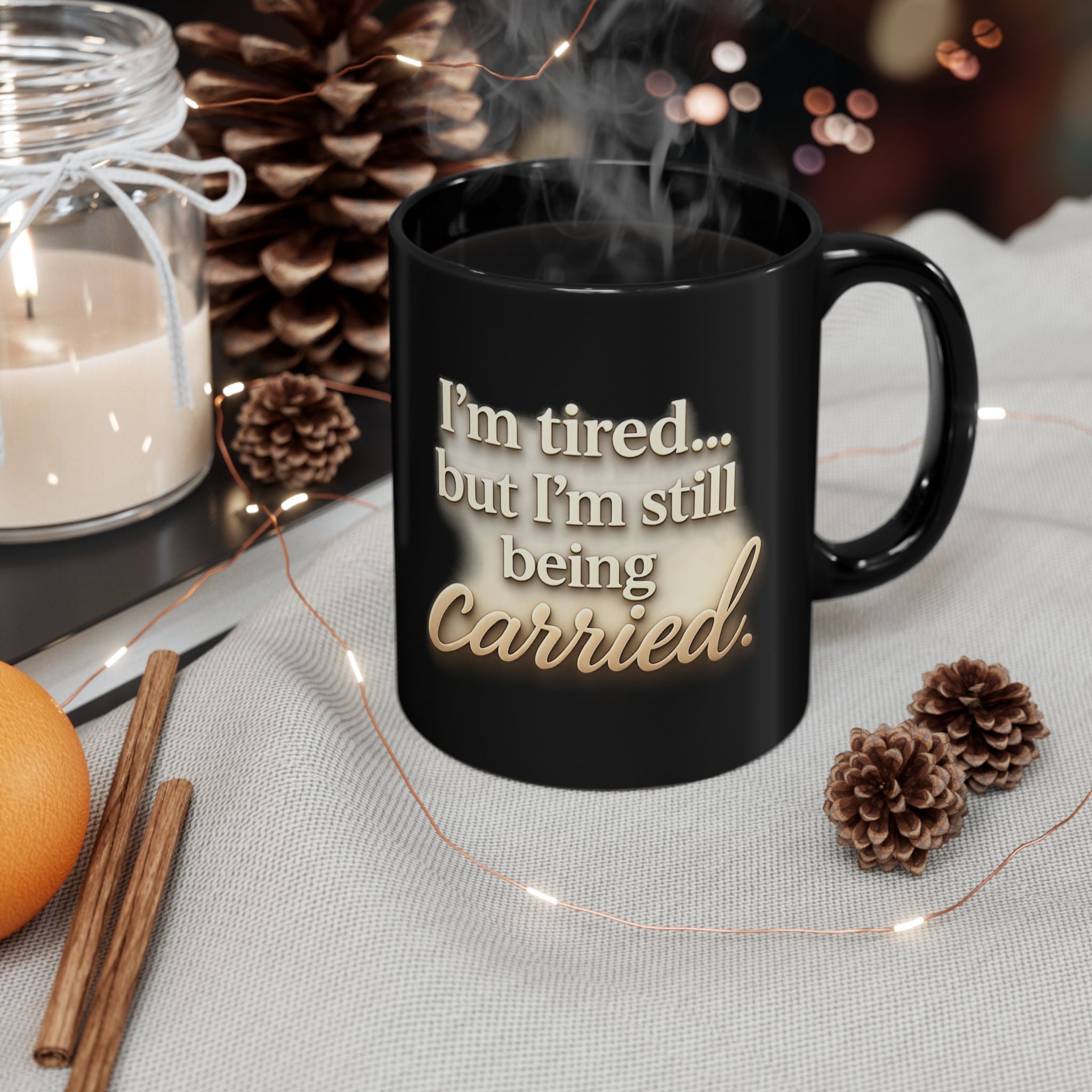 Christian faith encouragement mug with "I'm Tired But Still Being Carried" quote