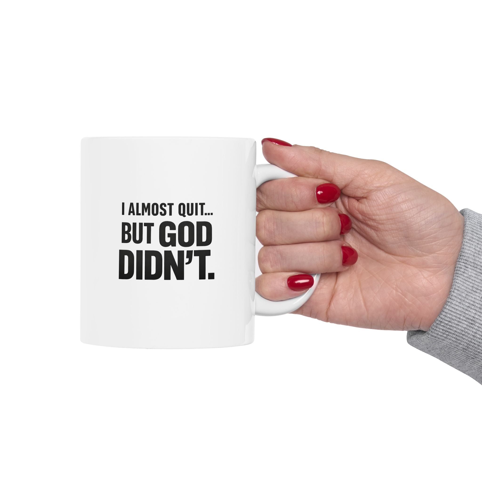 Christian faith encouragement mug with "I Almost Quit But God Didn't" quote